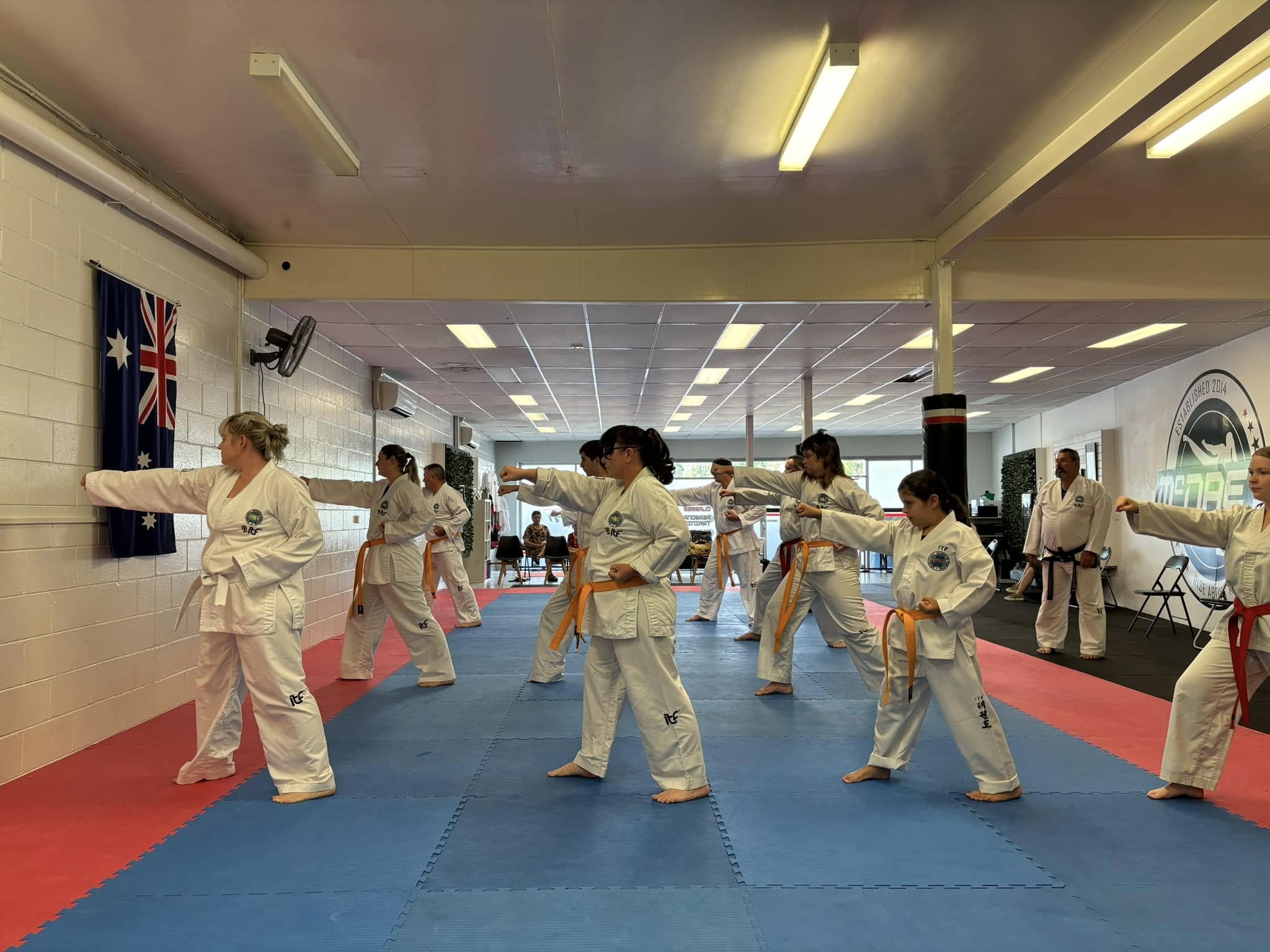 MMAFC students practicing punches in class